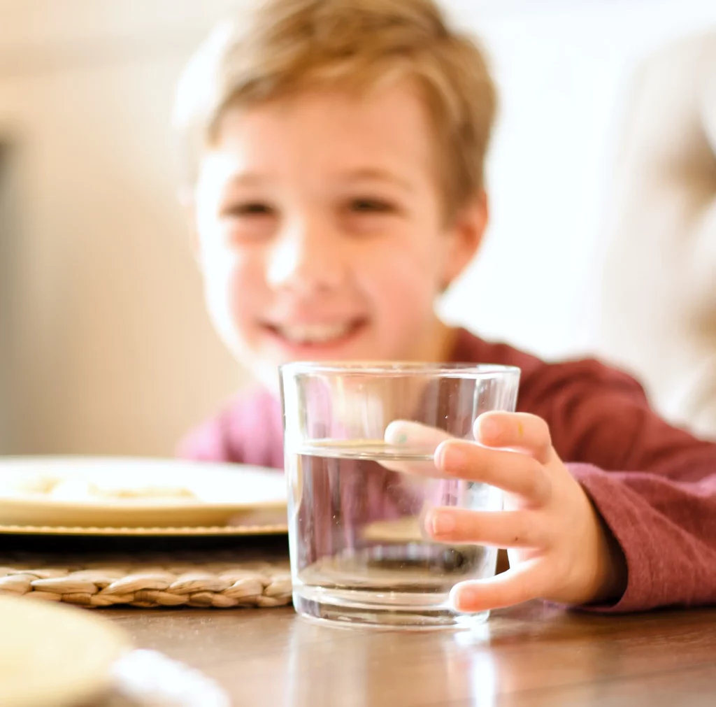 Child with ultra pure Le Bleu Water